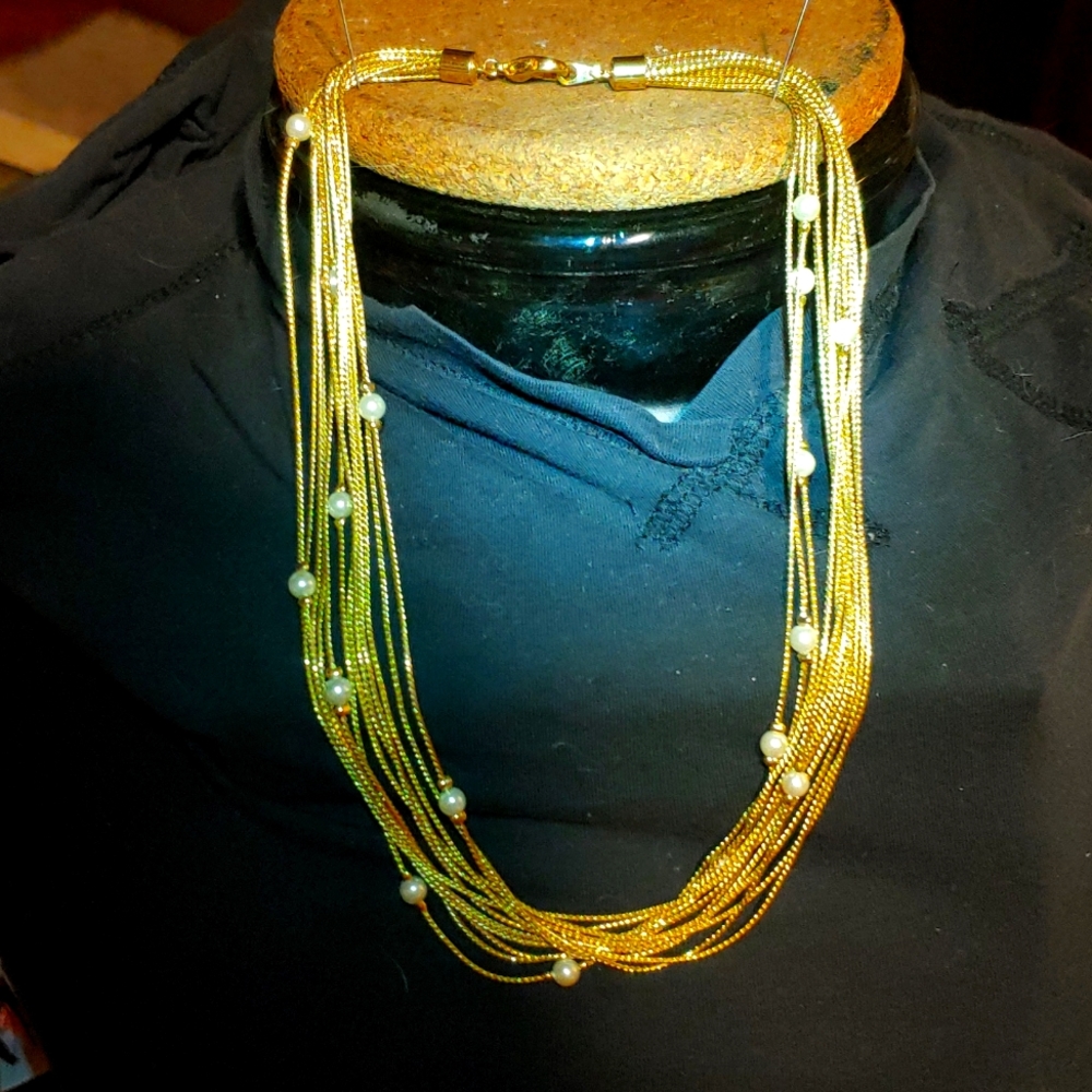 Multi strand gold tone necklace